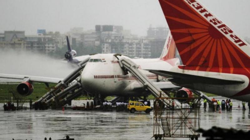 Air India plane carrying 185 people catches fire news