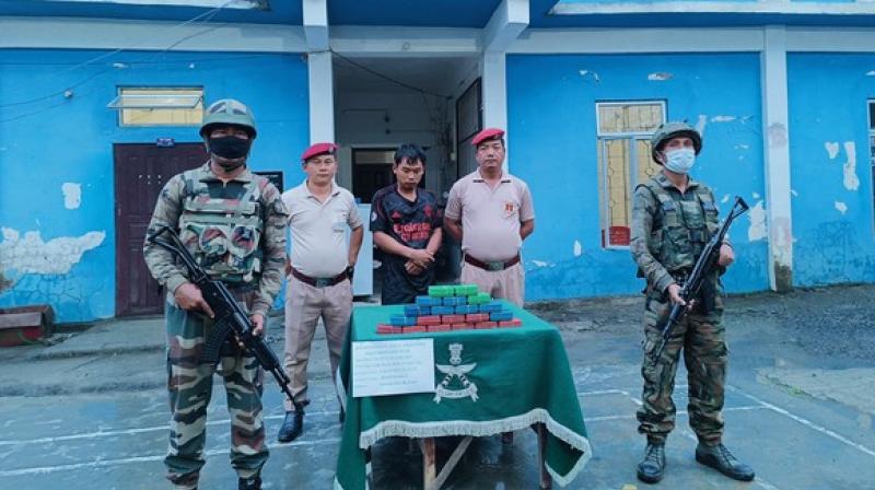 photo ( arrested accused by Assam Rifles with drugs worth Rs 1.65 crore in Mizoram's Champha)i