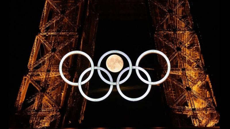 Moon aligns itself between Olympic Rings at Eiffel Tower ahead of opening ceremony in Paris News