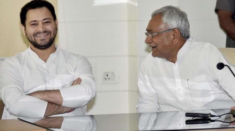 Tejashwi  touched Nitish Kumar feet and blessed him .