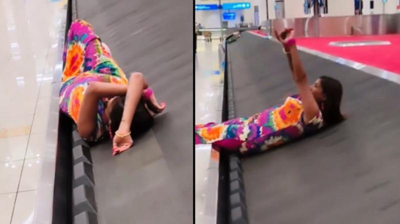 Girl making video while lying on conveyor belt goes VIRAL news in hindi