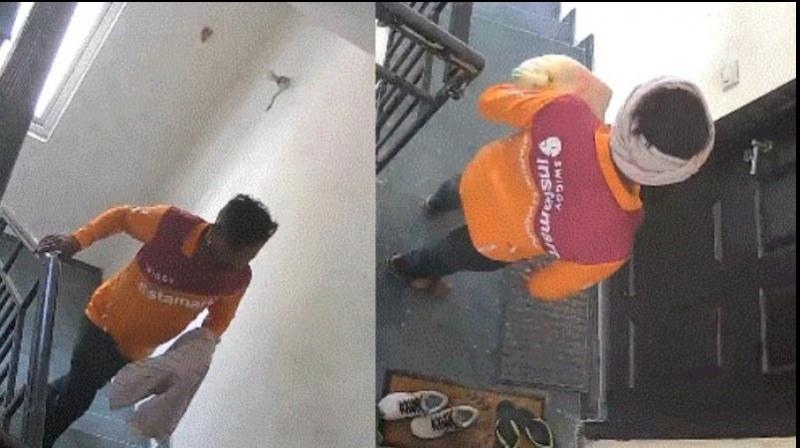 swiggy delivery man steals expensive nike shoes kept outside flat in Gurugram CCTV 